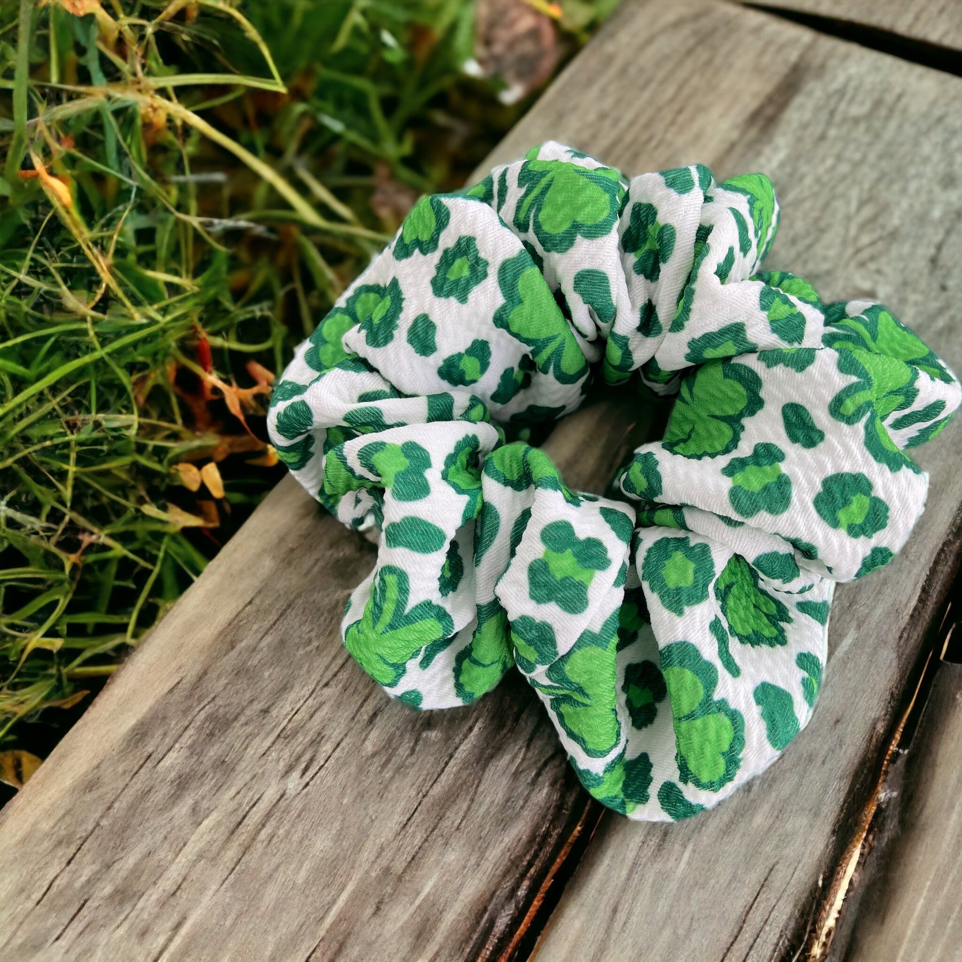 green and white shamrock scrunchie on bench