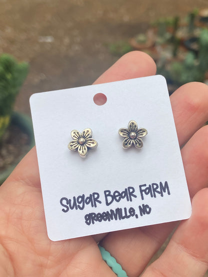 silver colored flower stud earrings