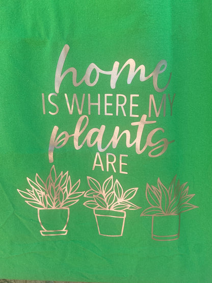 Green tote bag that reads home is where my plants are