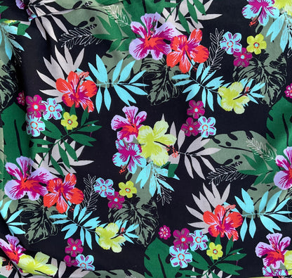 black, blue, and red tropical floral fabric