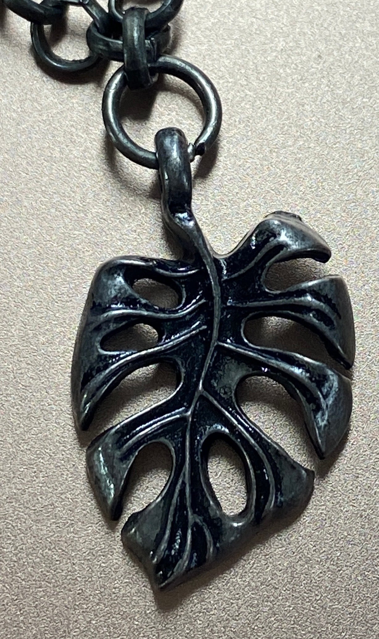 gunmetal monstera charm