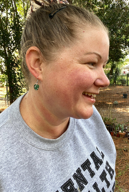 woman wearing thai constellation hand painted earrings