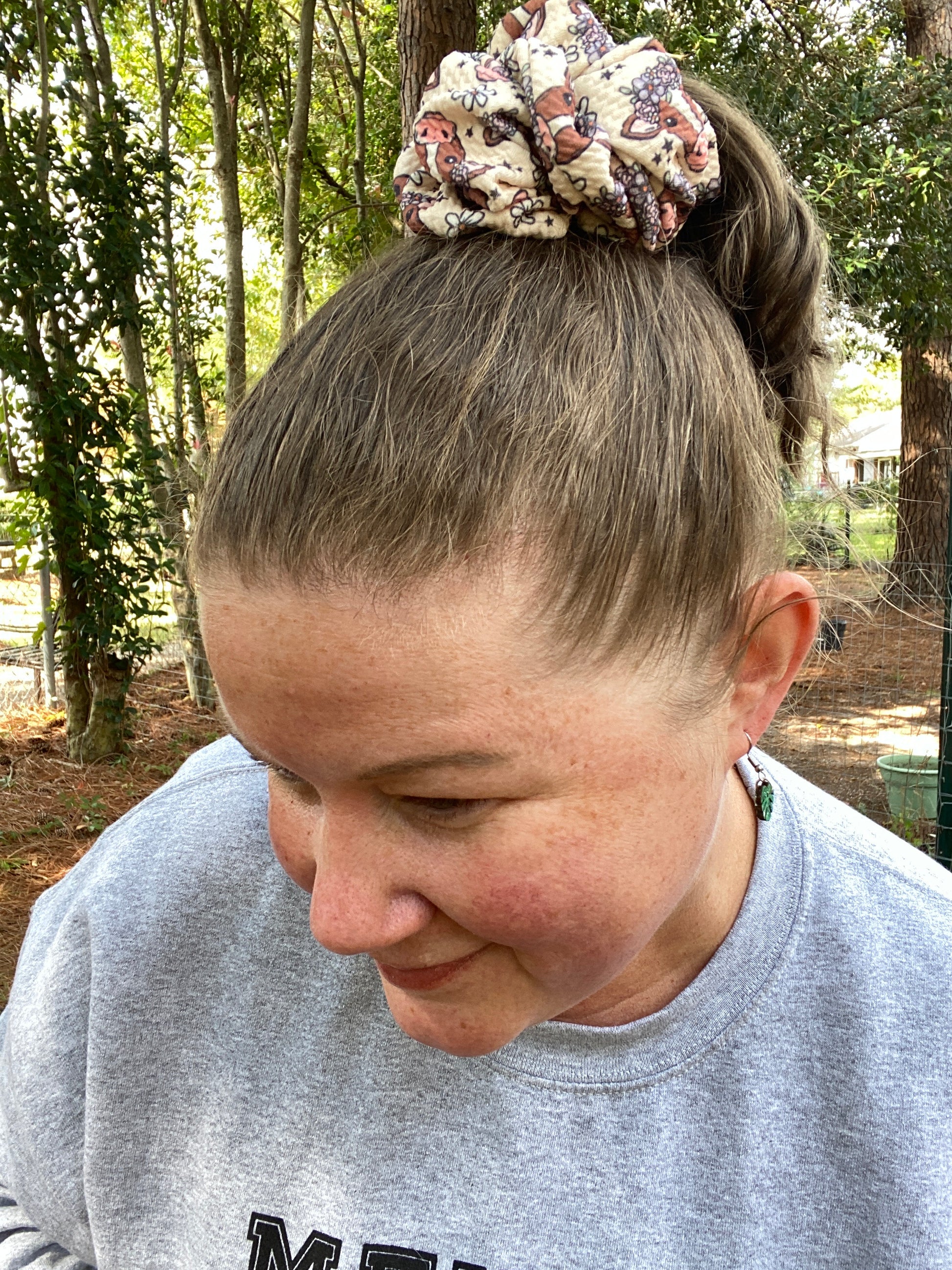 Woman wearing a cow face scrunchie