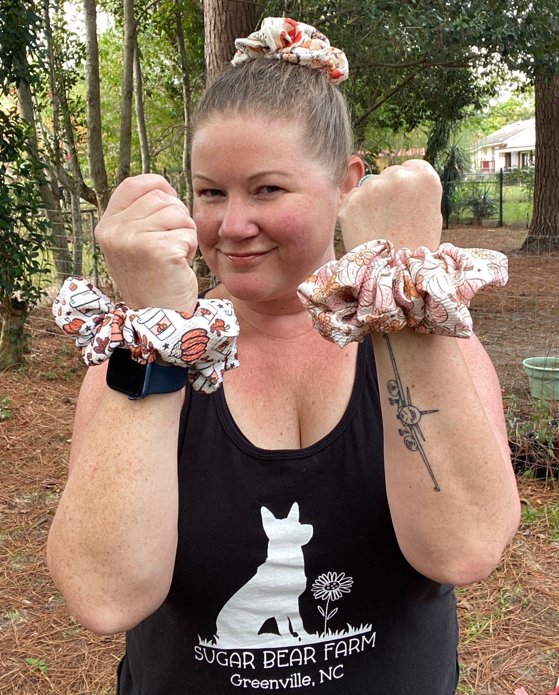 woman wearing white and orange pumpkin scrunchie