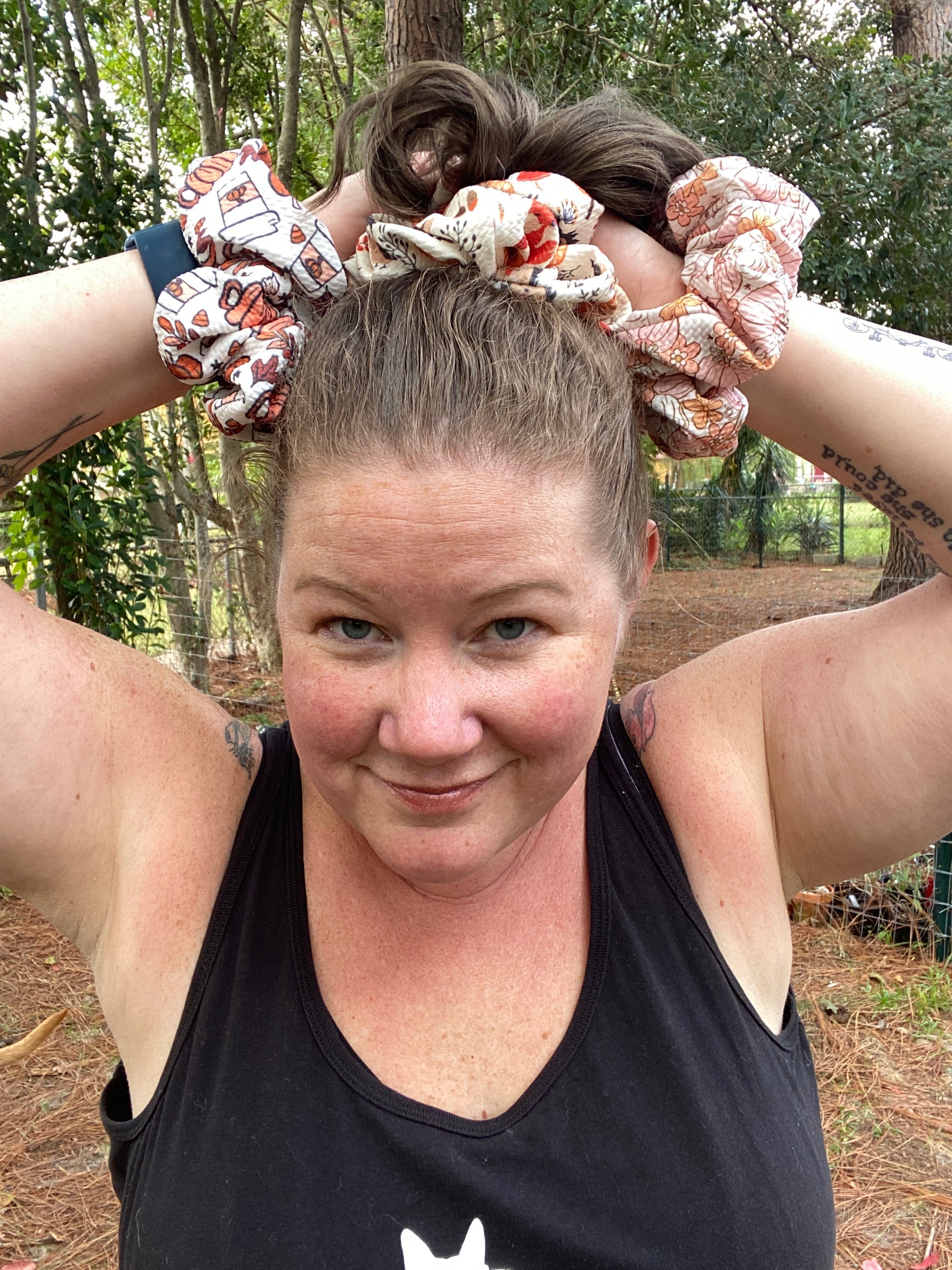 woman wearing white and orange pumpkin scrunchie