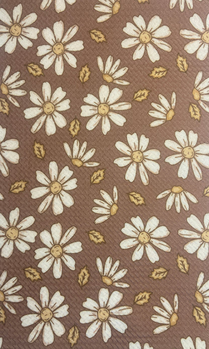 brown and white flower fabric