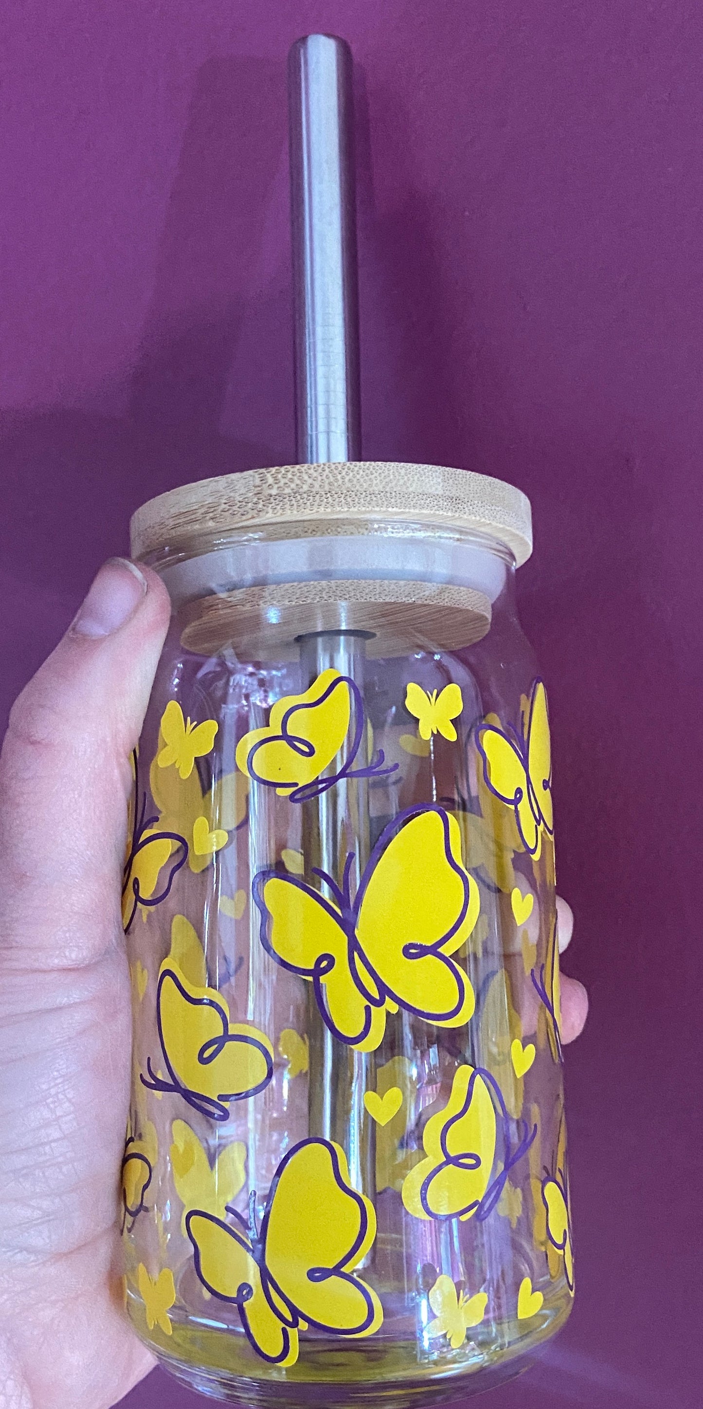 Beer glass with yellow and purple butterflies