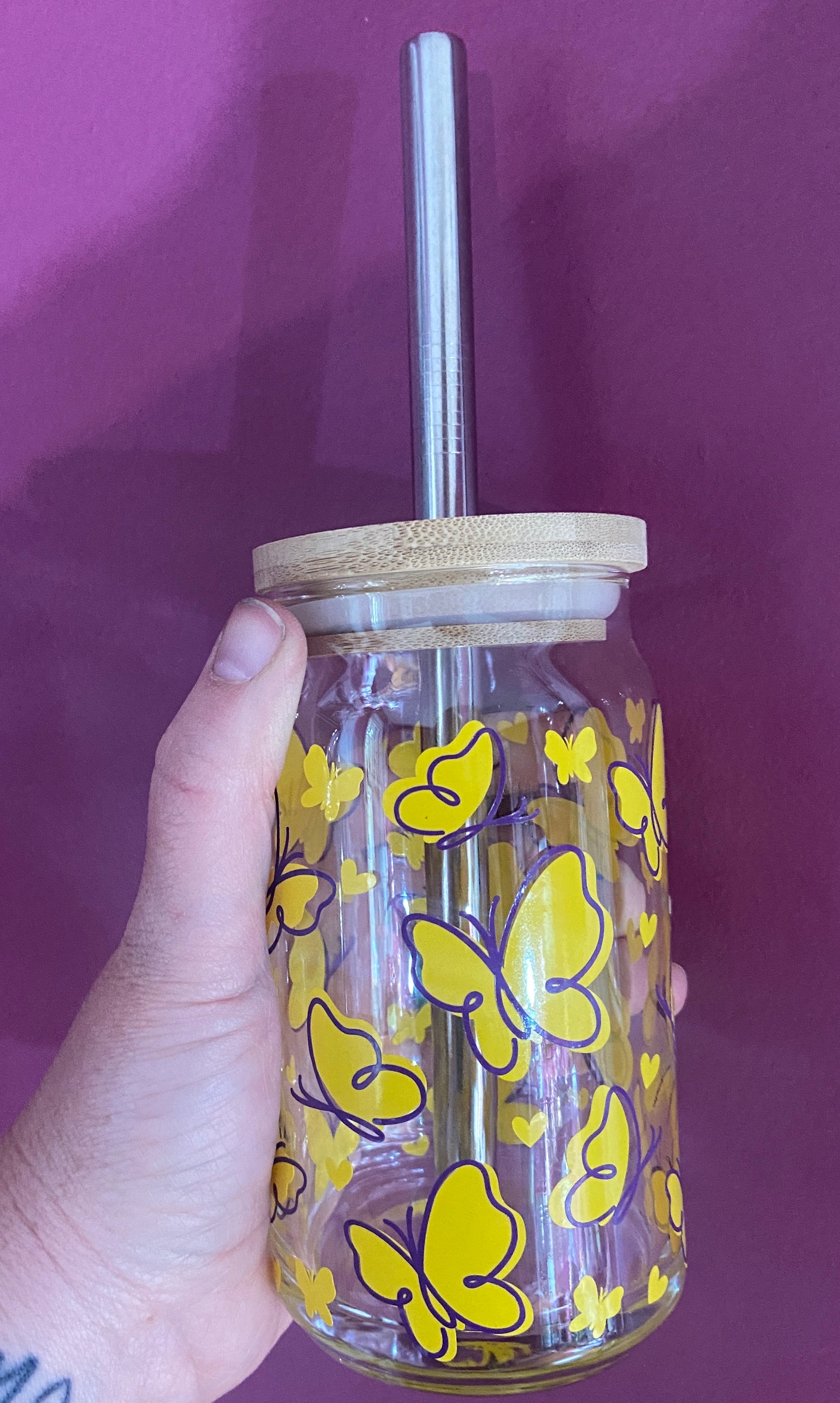 Beer glass with yellow and purple butterflies