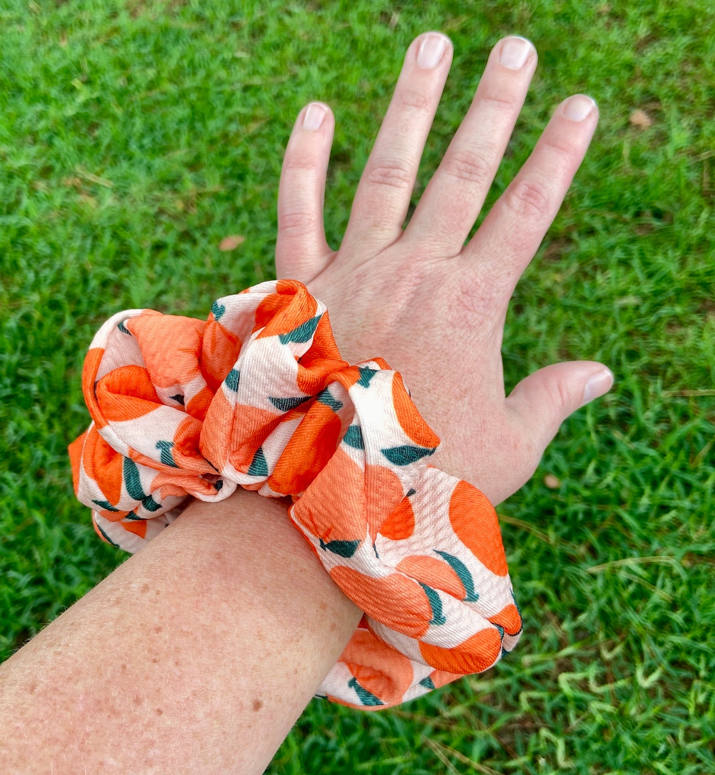 peach scrunchie on hand