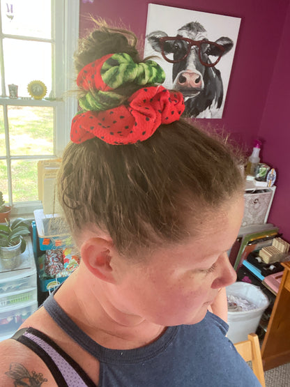 woman wearing red and green watermelon half and half scrunchie