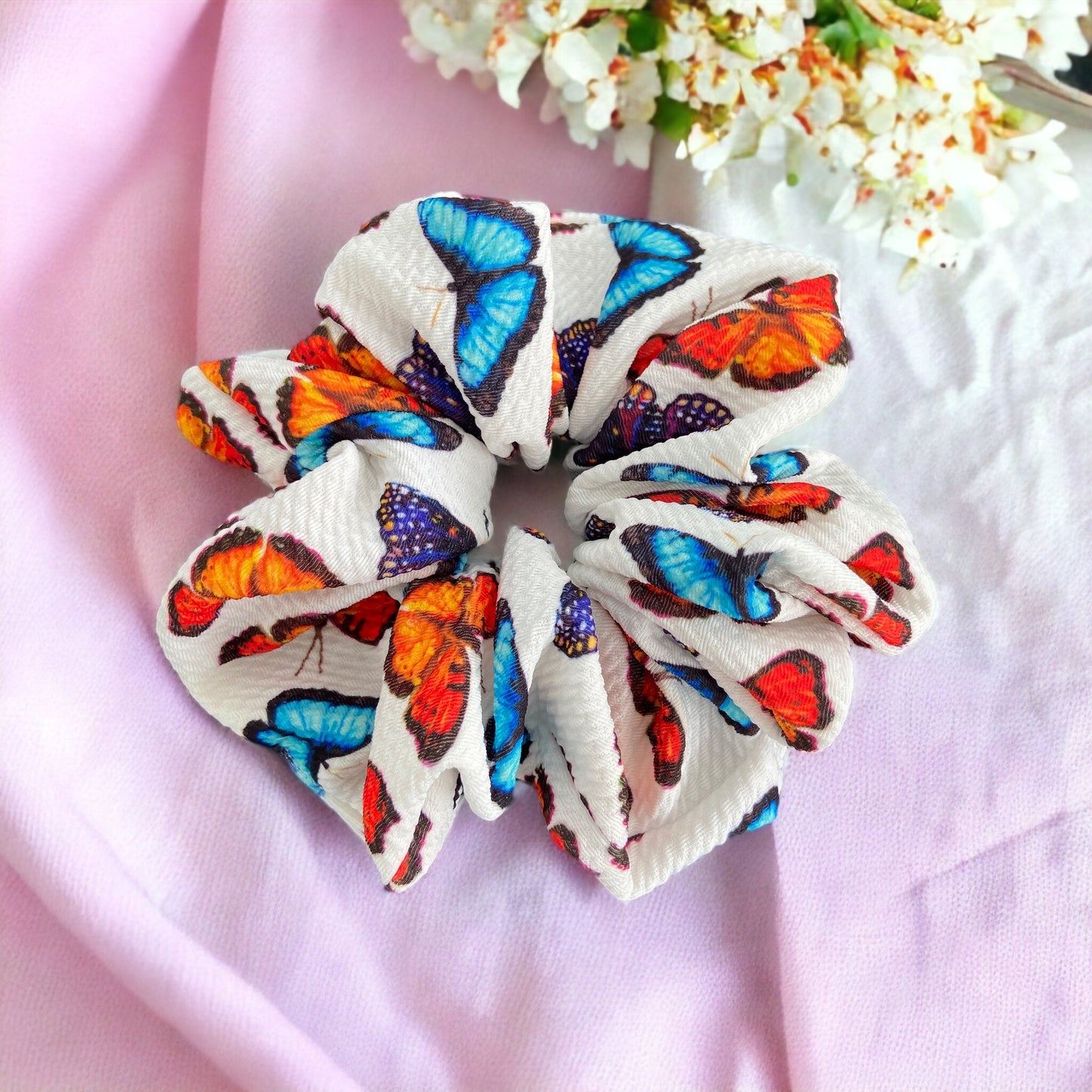 Butterfly scrunchie on pink background