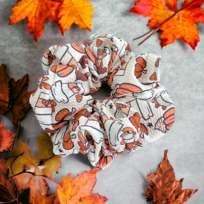 white and orange pumpkin scrunchie