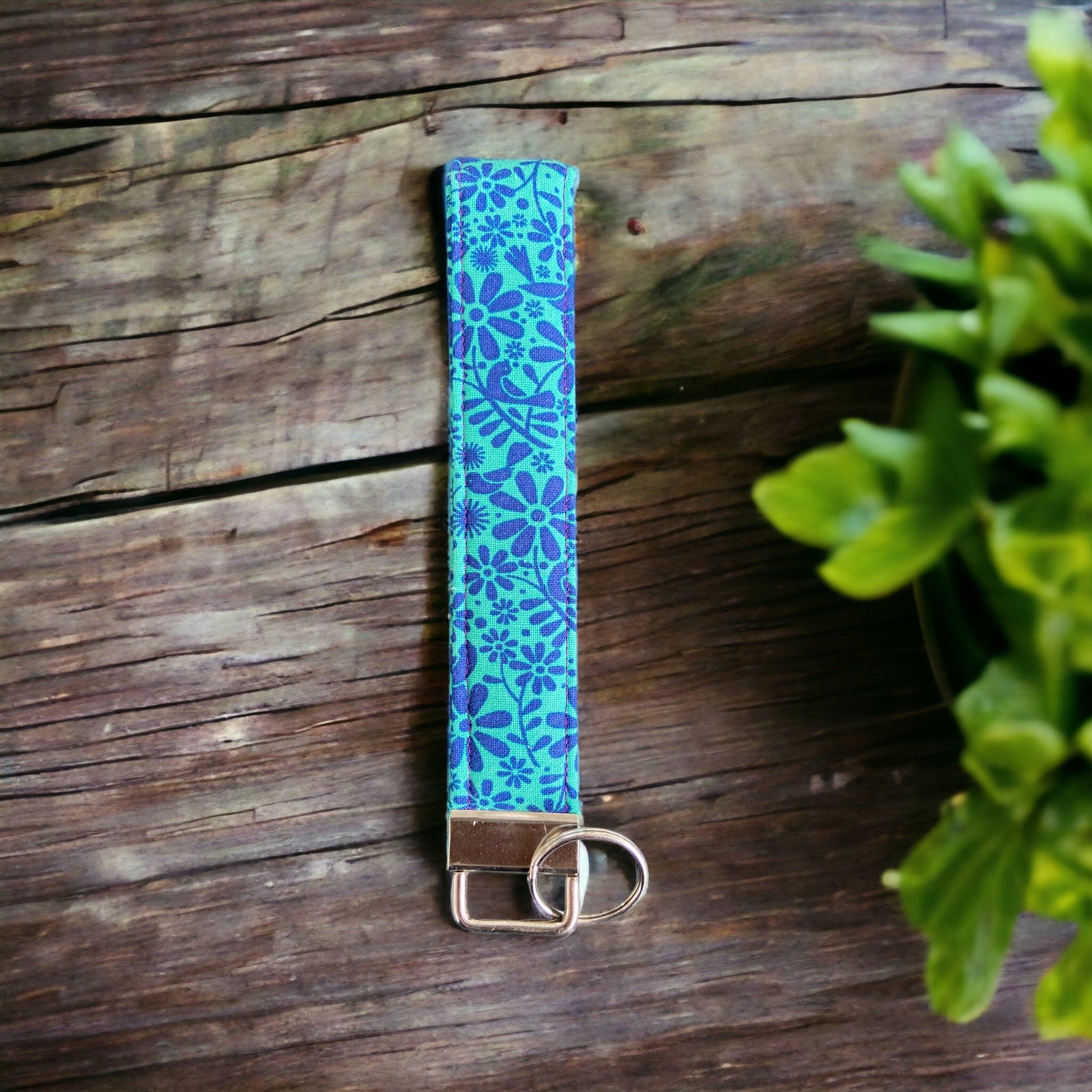 blue flower wristlet on wood