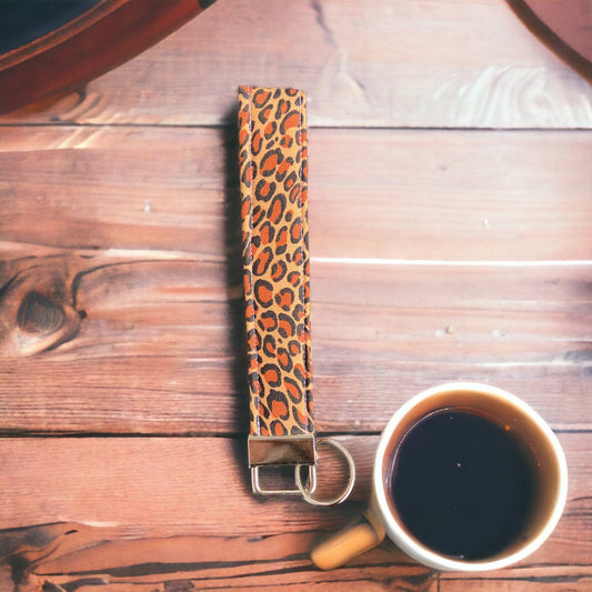 cheetah print wristlet and coffee