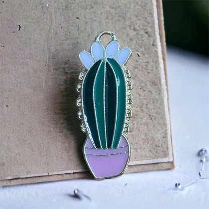 close up of metal cactus charm