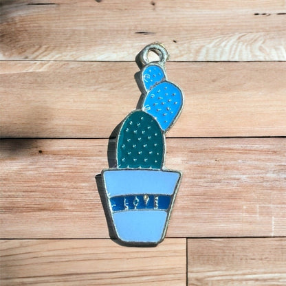 Close up of metal cactus charm