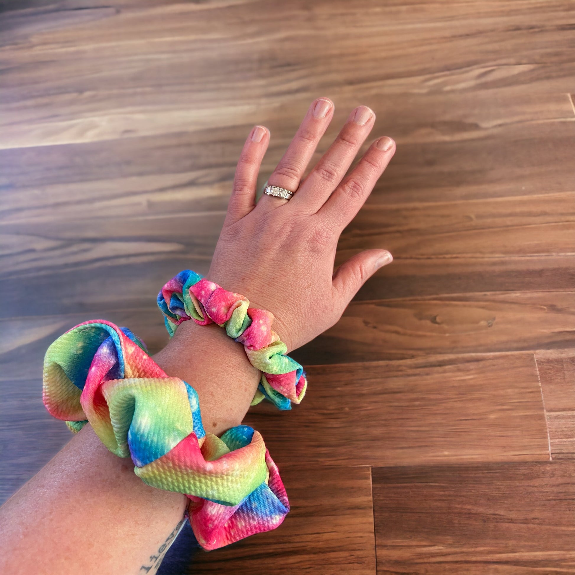 rainbow sparkle scrunchie on arm