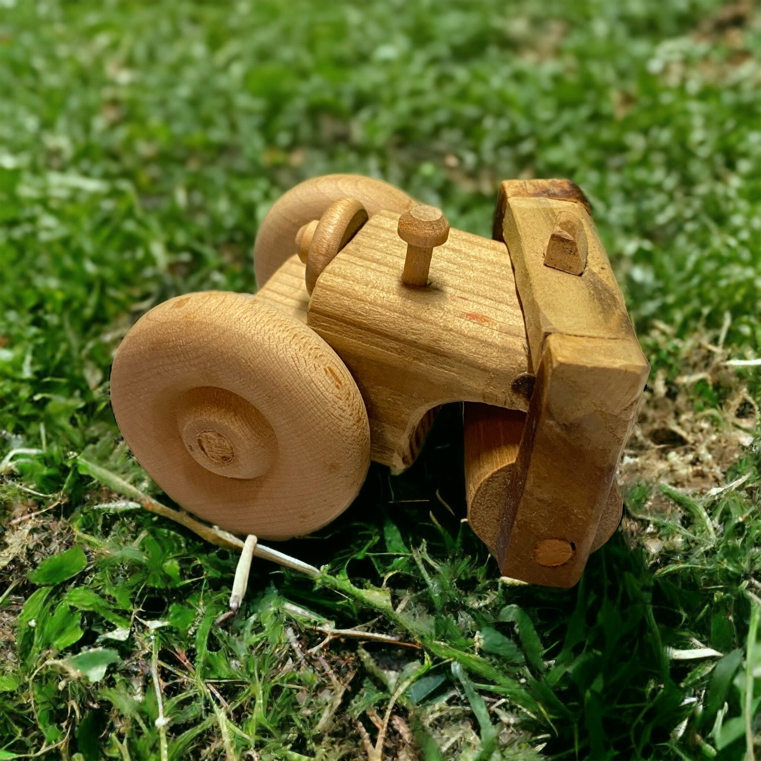 wooden steamroller on grass