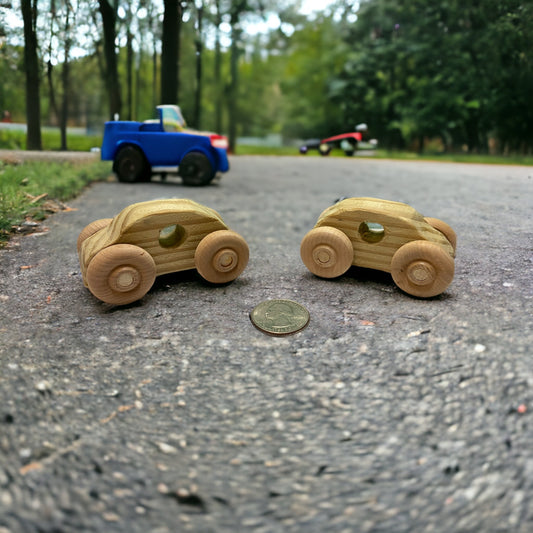 two wooden cars outside