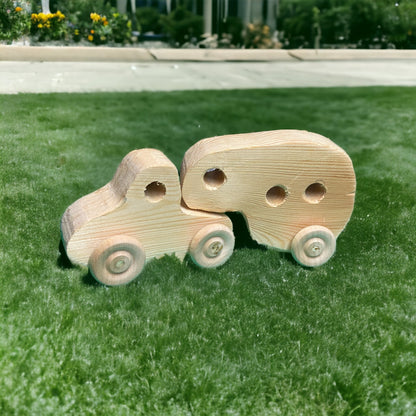 small wooden truck with camper on grass