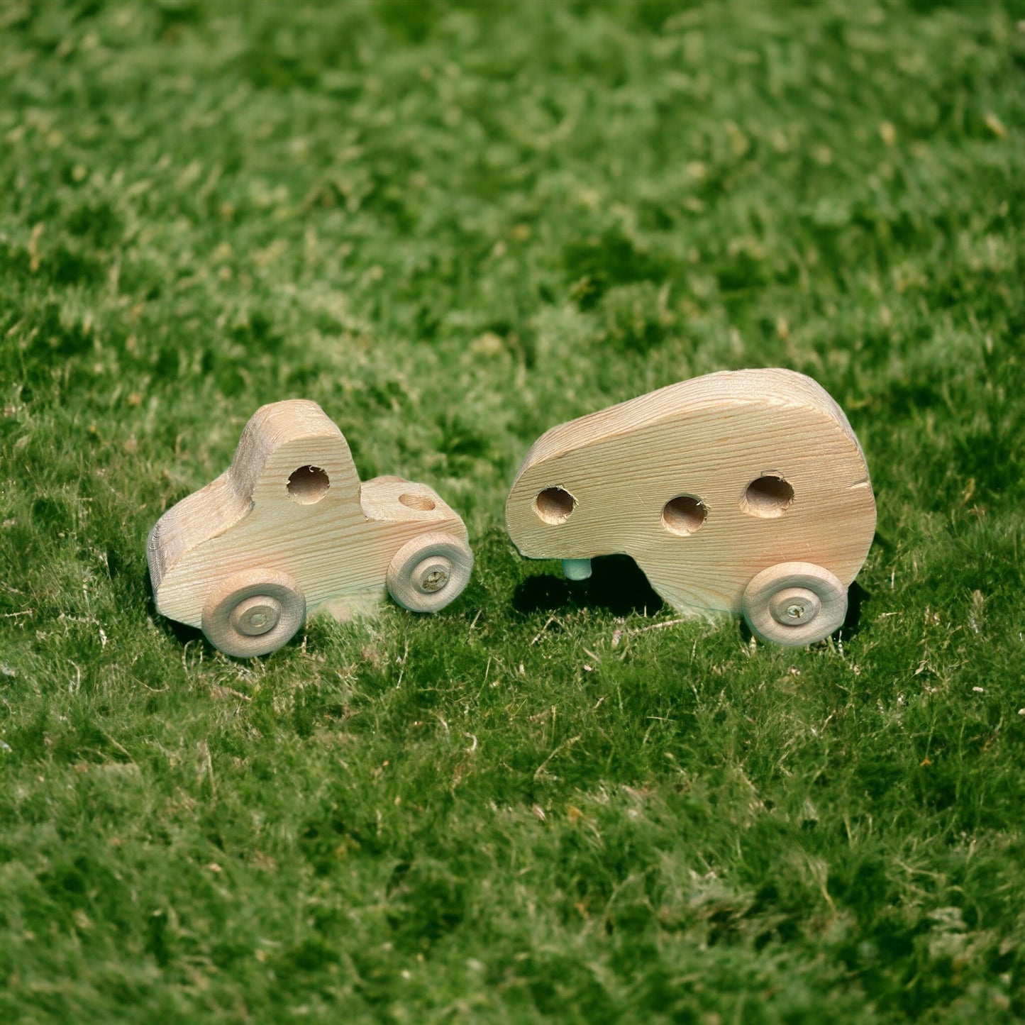 small wooden truck with camper on grass