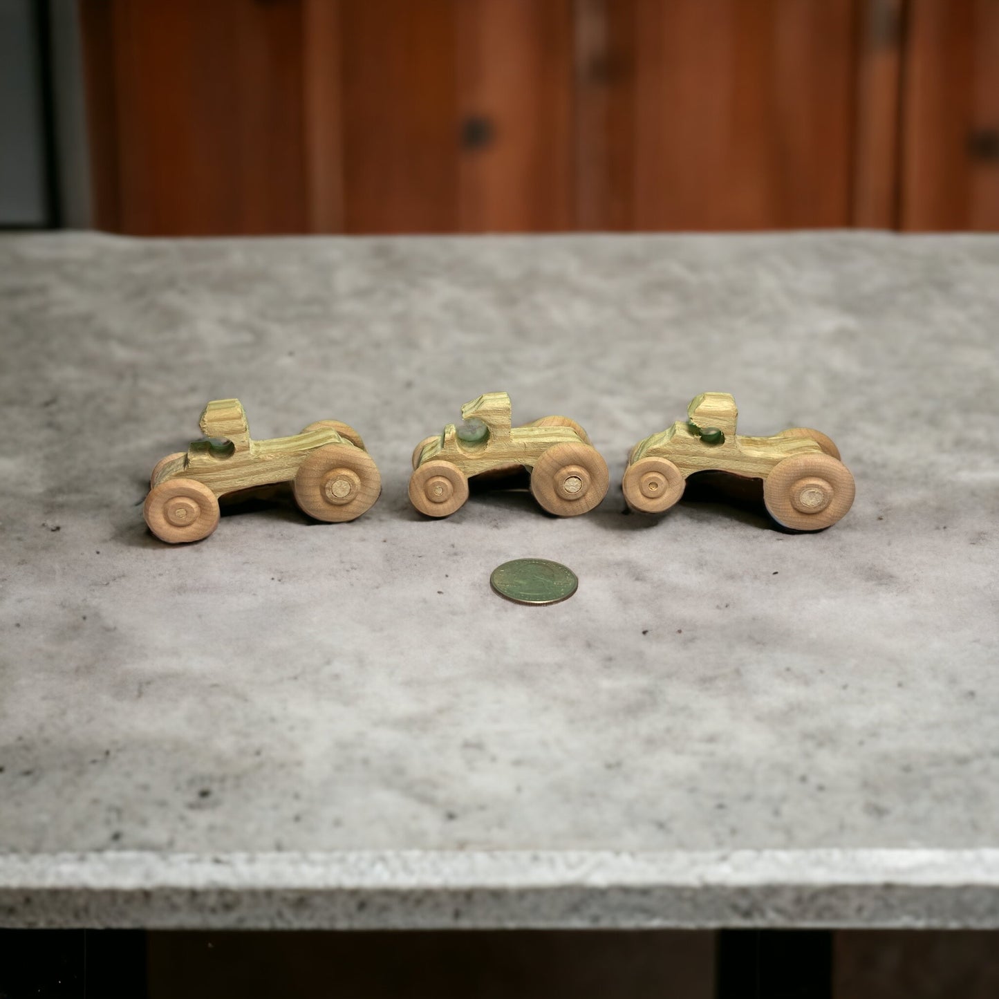 three Wooden trucks