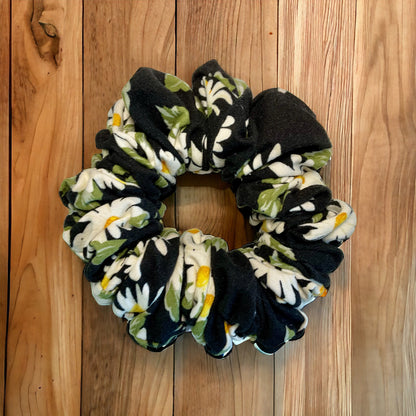 black scrunchie with white and yellow flowers