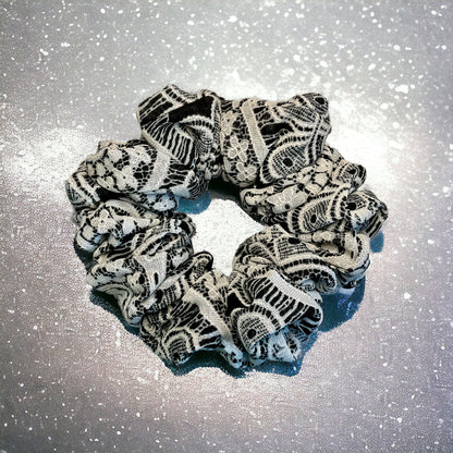 black and white lace scrunchie on glitter background