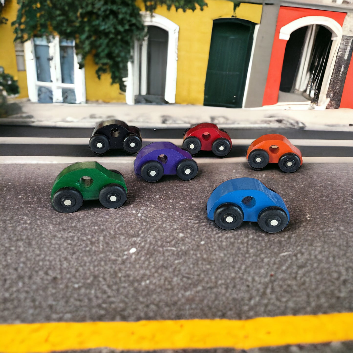 six painted cars on the street