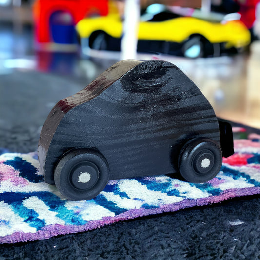 black wooden car on carpet