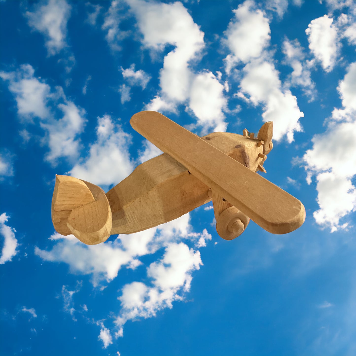 Wooden Airplane with sky background