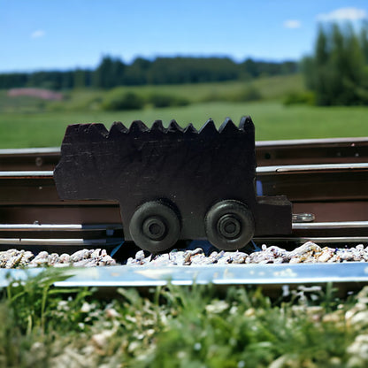 wooden black coal train on tracks