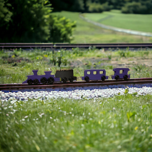 wooden purple train on tracks