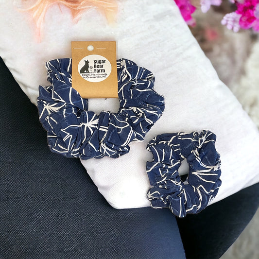 blue and white scrunchie on white pillow