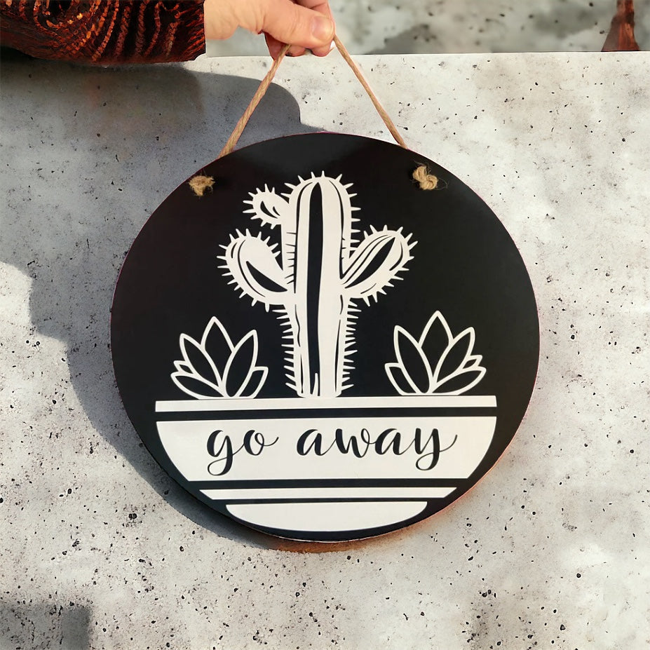 wooden sign with cactus and reads go away