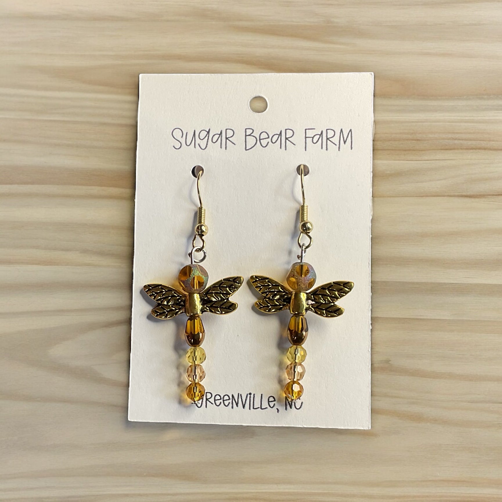 Gold colored dragonfly earrings