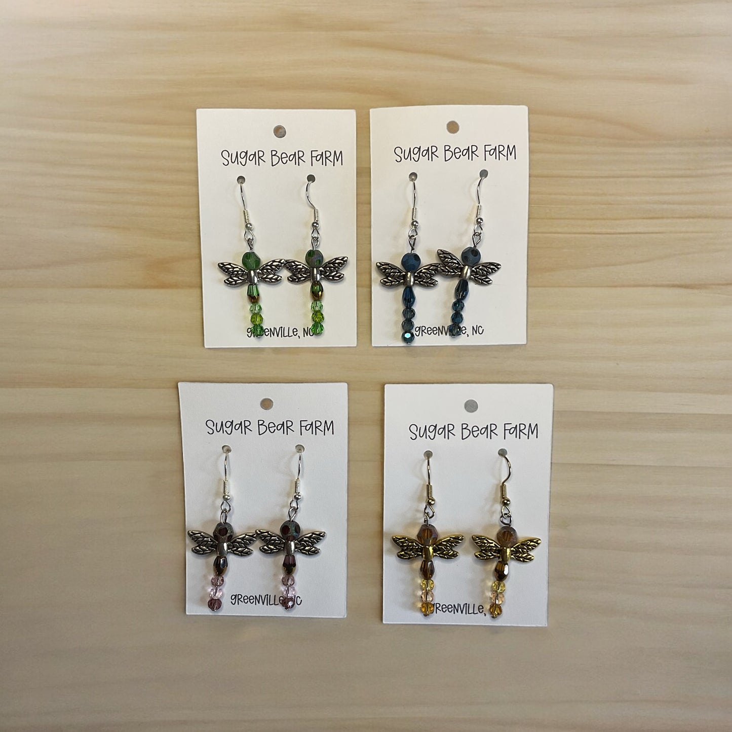 four pairs of dragonfly earrings