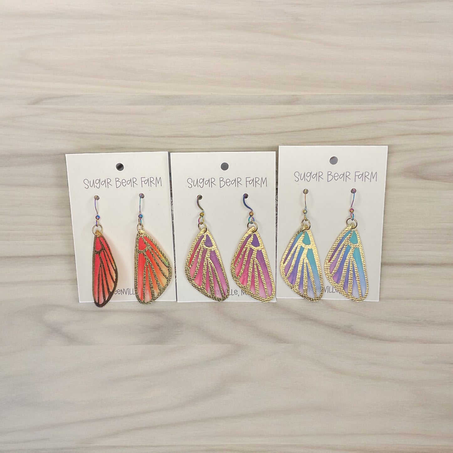 three pairs on butterfly earrings