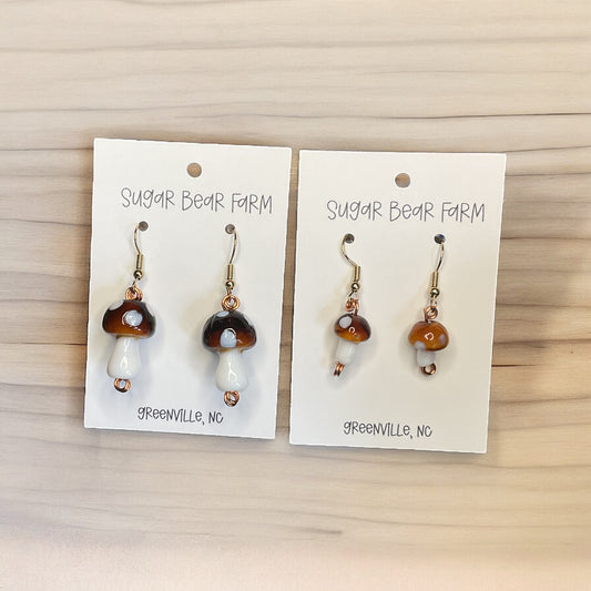 two pairs of brown and white glass mushroom earrings