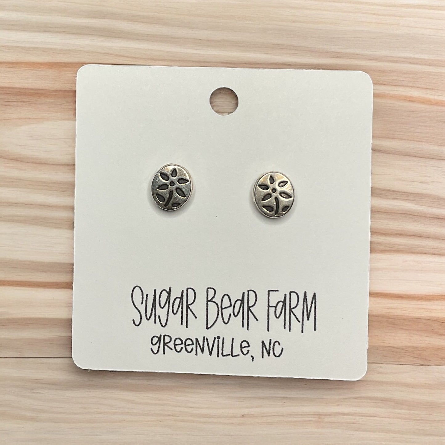 silver colored flower stud earrings