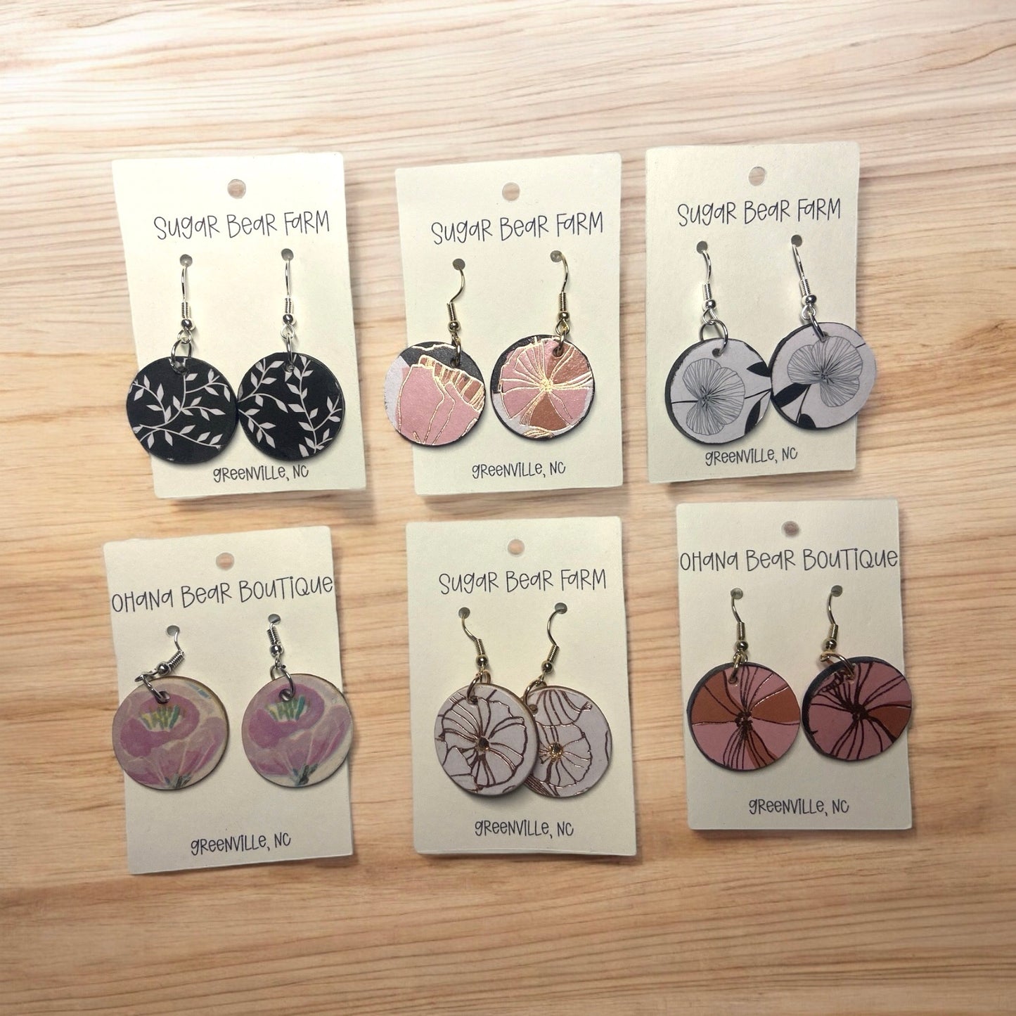 six pairs of wooden floral earrings