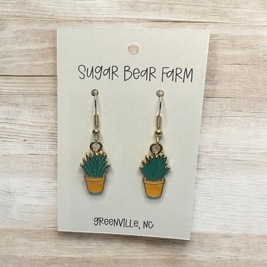 green snake plant in a yellow pot earrings