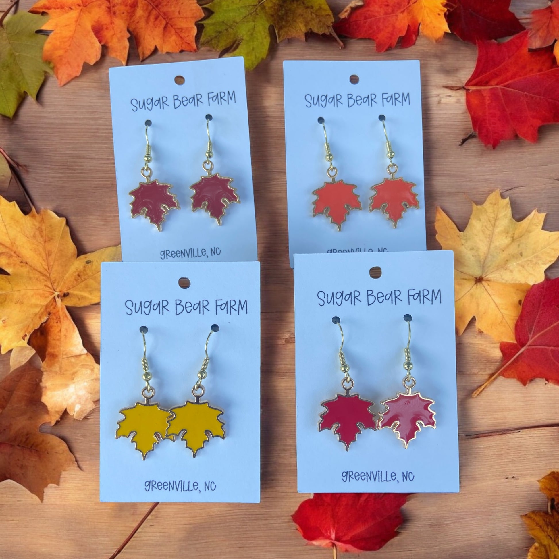 four pairs of leaf earrings