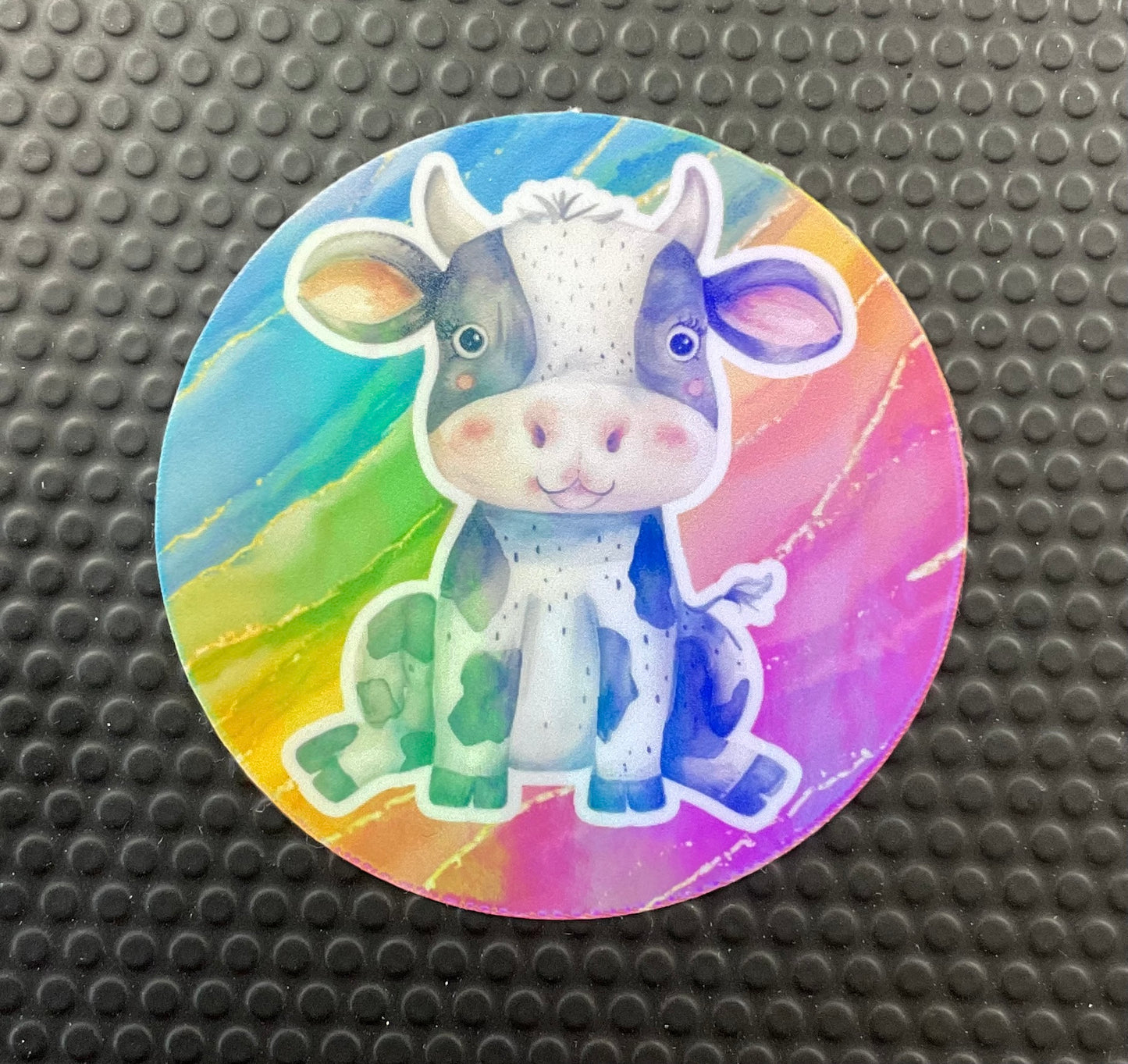 cartoon cow on rainbow background