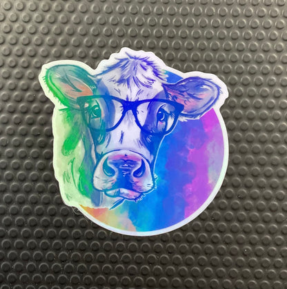 Cartoon cow in glasses with a rainbow background