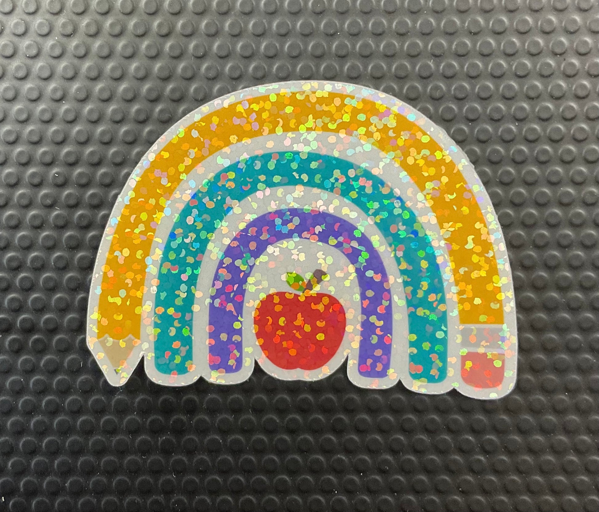 pencil rainbow sticker with a red apple