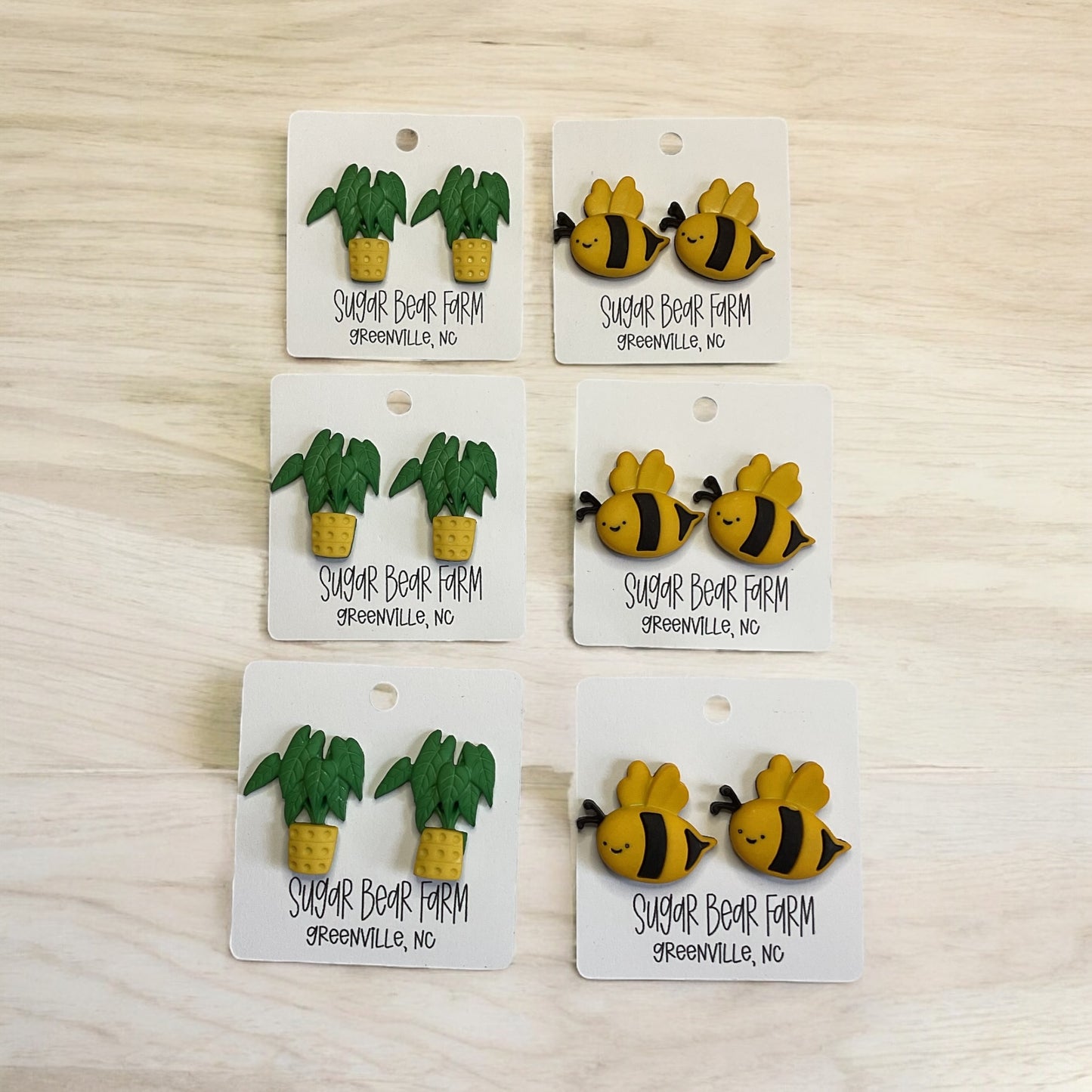 potted plant earrings and bumble bee earrings