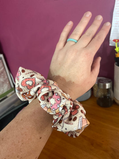 coffee and hearts scrunchie on wrist