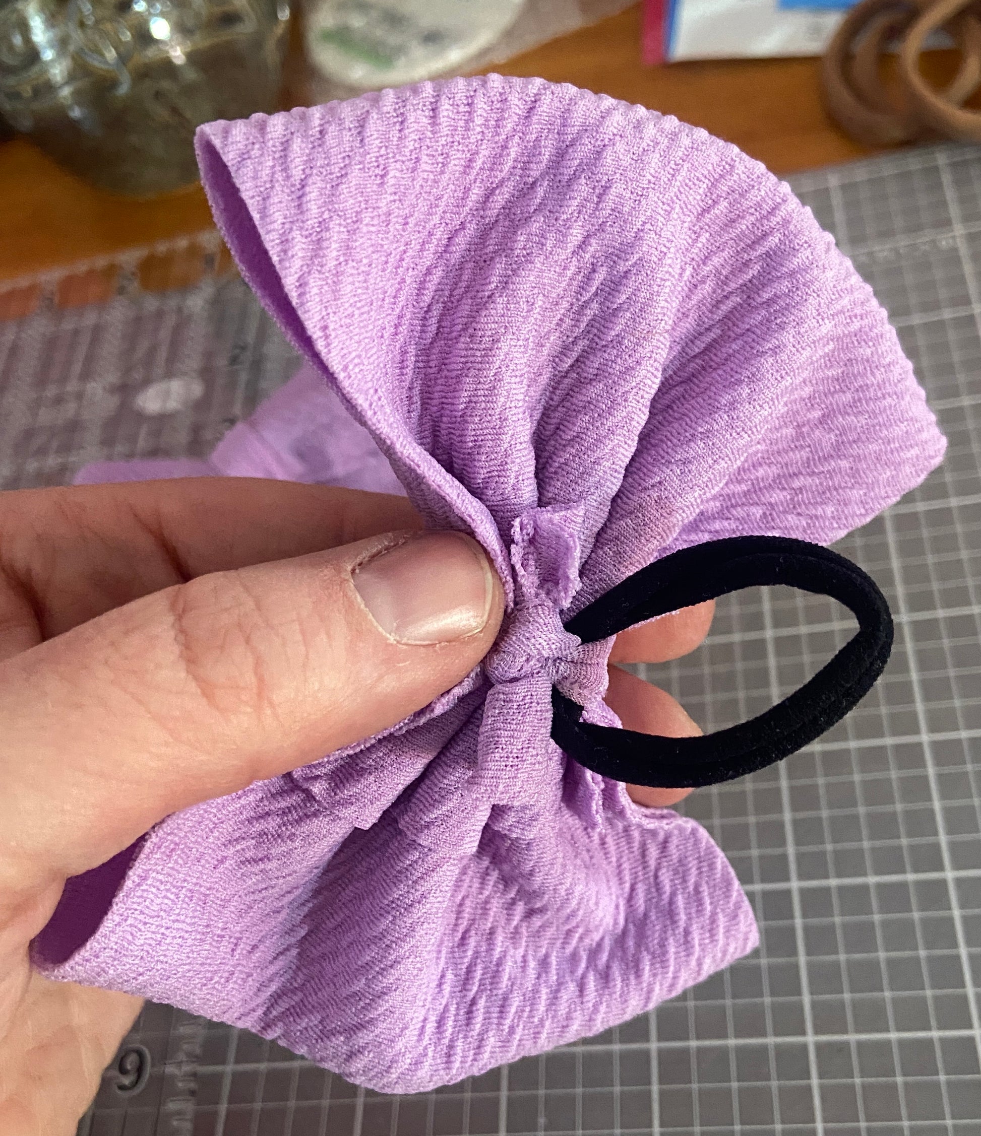 purple bow with hair tie