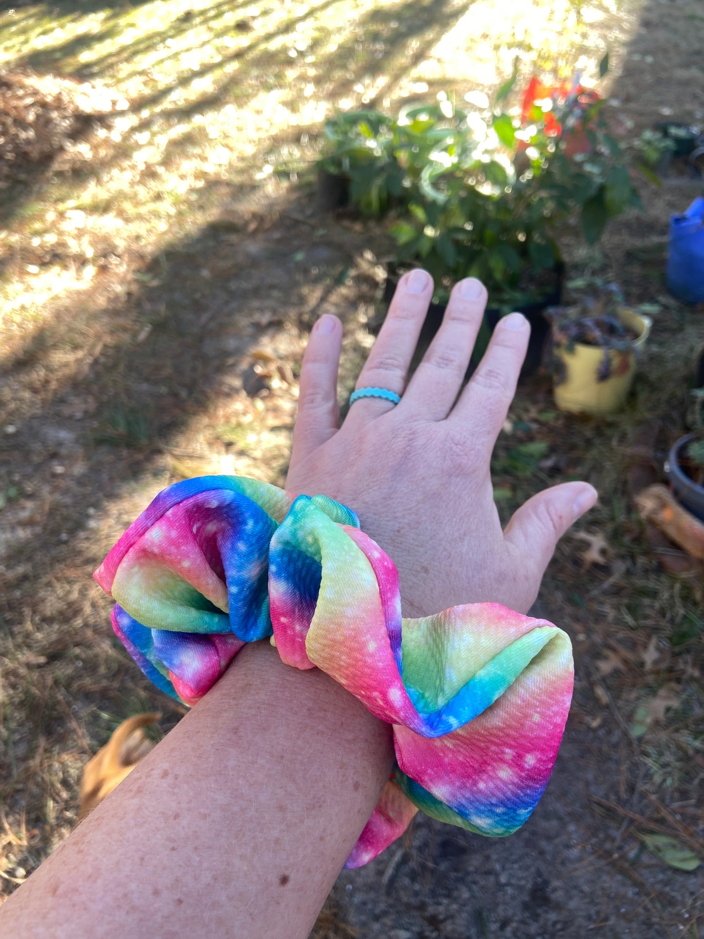 rainbow sparkle scrunchie on arm